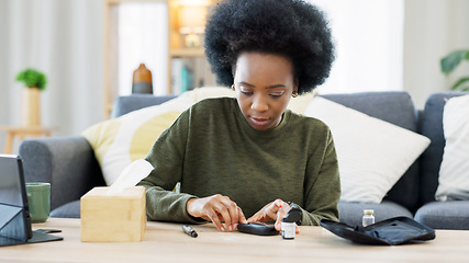 Image showing Happy African American woman using a glucose monitoring device at home. Smiling black female checking her sugar level with a rapid test result kit, daily routine of diabetic care in a living room