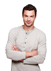 Image showing Handsome man, smile and arms crossed in focus with vision for happy ambition, goal or profile against white background. Portrait of a isolated young male smiling with crossed arms on white background