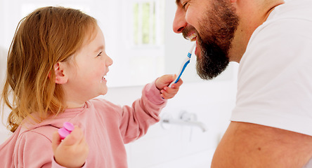 Image showing Happy family, dental and brushing teeth with girl and father in bathroom for hygiene, learning and grooming. Love, teeth and oral care by parent with daughter play, laugh and cleaning in their home