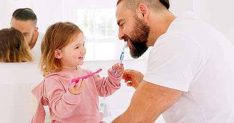 Image showing Dental health, father and girl for brushing teeth, together or laugh in bathroom in home to have fun. Oral hygiene, dad and daughter with tooth brush, being happy or bonding for happiness or in house