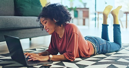 Image showing Music, laptop and relax girl on floor carpet streaming radio rap, disco or rock song while singing trendy audio. Headphones, energy or student black woman listening to wellness sound and typing on pc