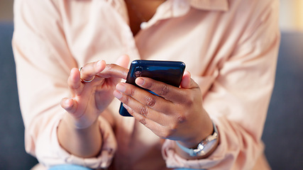 Image showing Closeup of hands texting on phone, typing social media post and searching or scrolling online. Relaxed woman sitting alone on home living room sofa and networking and browsing internet on technology