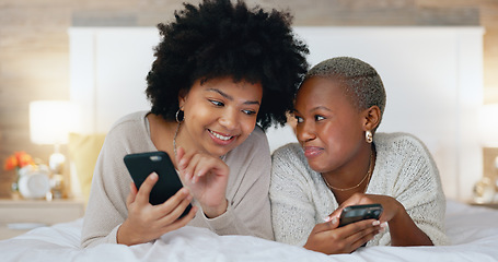 Image showing Friends, phone and laugh in house bedroom, home interior or relax hotel with social media technology for dating app profile search. Smile, happy and comic women with mobile for fun communication