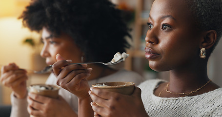 Image showing Relax, ice cream and women friends eating together on the weekend to bond with frozen dairy treats. Black people in girl friendship enjoy sweet dessert break to relax while resting in home.