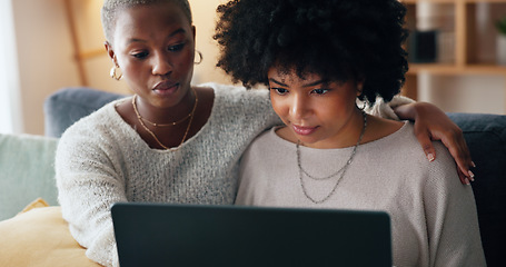 Image showing Friends online shopping on a laptop for discount or sale on a digital fintech website at home. Ecommerce, happy and excited African women on the sofa banking on the internet