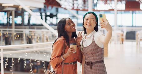 Image showing Phone selfie, women and friends with peace sign at mall taking pictures for social media. Bokeh, hand gesture and girls taking photo on mobile smartphone for profile picture or happy memory together.