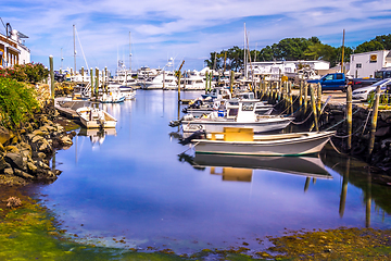 Image showing Small boats lining waterfront in Wickford Cove