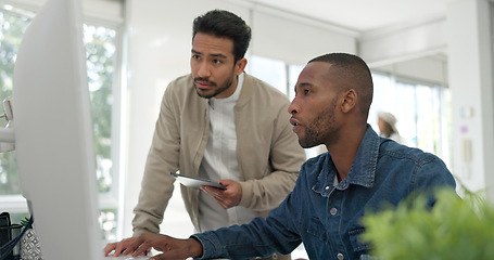 Image showing Businessman, startup and coaching conversation at desk with tablet, computer and question for mentor in office. Black man, web design coach and learning in workplace for support, advice or teamwork