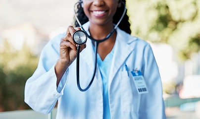 Image showing Woman, stethoscope and cardiology doctor for healthcare, life insurance and medical care for wellness. Hand of medicine professional or expert for heart health, healing or hospital consultation check