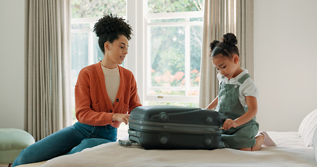 Image showing Travel, luggage and mom packing with child in bedroom getting ready for trip. Helping hands, black family and young girl help mother pack clothes in suitcase for holiday, vacation and weekend away