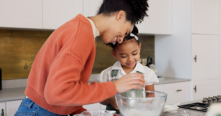 Image showing Family, children and baking with a woman and girl cooking in the kitchen of their home together. Food, taste and love with a mother and daughter adding ingredients to a bowl while preparing a dessert