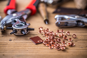 Image showing Punch tools and buckles