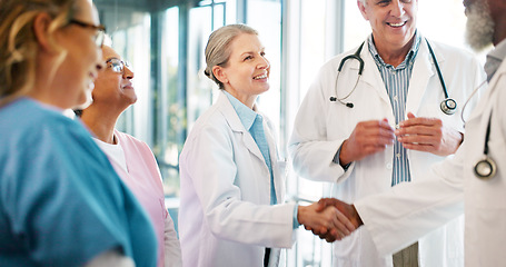 Image showing Handshake, congratulations and healthcare, woman and black man shaking hands or applause for good job in medicine. Doctors, thank you and welcome to new recruit or partner at hospital with hand shake