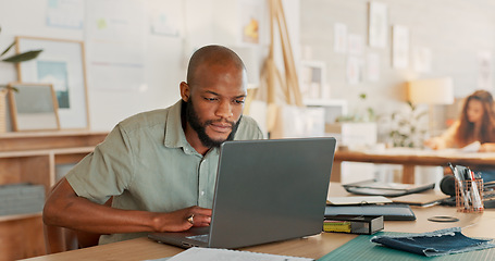 Image showing Email, phone and businessman working, planning and in communication with people on the internet at work. African manager, worker or employee typing on a laptop and reading on a mobile in an office