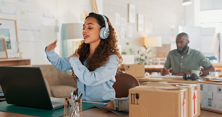 Image showing Video call, customer service woman in a courier office for product consulting, sales negotiation or ecommerce. Logistics, customer support or business consultant laptop, headphones and shipping boxes