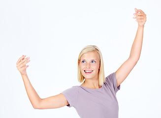 Image showing Woman, happy dance and studio by white background with smile, artistic and beautiful movement. Isolated model, dancer and happiness with excited dancing, beauty and arms in air by studio background