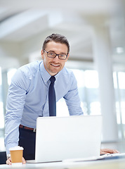 Image showing Portrait, laptop and vision with a business man at work in his office for research or innovation. Computer, mindset and mission with a male employee working on a report or planning for success