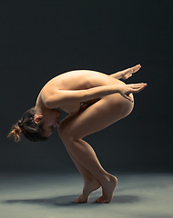 Image showing Body, nude and ballet with a model woman in studio on a dark background for dance or performance arts. Creative, skin and beauty with a female ballerina posing naked on black for artistic freedom