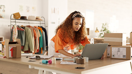 Image showing Logistics, laptop and fashion manager of retail or boutique shop checking clothing stock in boxes on a checklist. Small business, entrepreneur and young woman working with clothes inventory in store