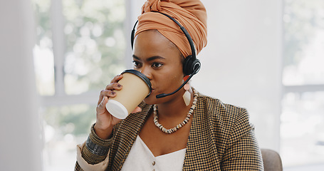 Image showing Call center, customer service and black woman consultant in the office consulting online while drinking coffee. Customer support, telemarketing and professional African female crm expert in workplace