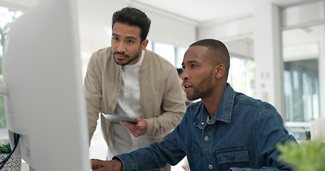 Image showing Businessman, startup and coaching conversation at desk with tablet, computer and question for mentor in office. Black man, web design coach and learning in workplace for support, advice or teamwork