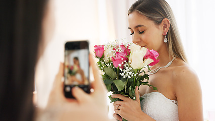 Image showing Phone photography of bride, bouquet and wedding celebration happy, love and smile in luxury designer dress at hotel. Rich girl, smartphone and flowers photo in bridal gown to celebrate marriage event