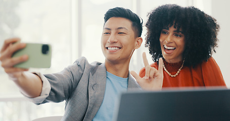 Image showing Phone, selfie and business people with peace in office for teamwork, collaboration and friendly workspace. Success, diversity and Asian man and black woman with smartphone, peace sign and smile