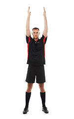 Image showing Referee, man whistle in portrait and arms raised, stop game with soccer and sport isolated on white background. Serious, assertive and fitness with mockup, football match and hand signal in studio