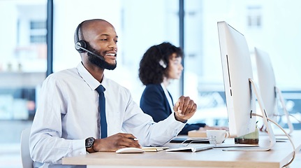 Image showing Callcenter, customer service or black man on computer for customer support, consulting or networking in office. Manager, CRM or sales advisor on tech for telemarketing, research or contact us help