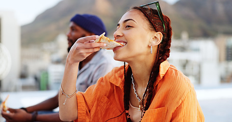 Image showing Pizza, rooftop and friends eating outdoor with cityscape for urban, gen z and youth lifestyle food. Happy, relax and hungry black people or woman and man with fast food and city buildings location