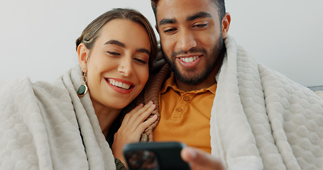 Image showing Happy, couple with phone for communication, networking or social media app at home. Movie, video or love man and woman relax in living room streaming online, internet or website with smile in house