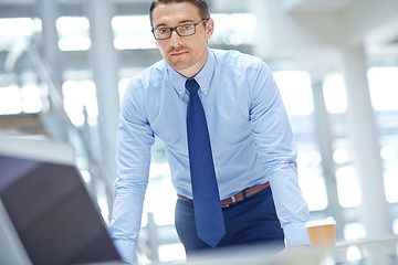 Image showing Portrait, mindset and mission with a business man at work by a desk in the office for future growth. Manager, trust or goal and a male employee working with a vision of company success or development