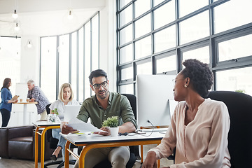 Image showing Office, business and colleagues talking or in discussion while working on a project in a coworking space. Interracial, communication and corporate employees in a conversation or consult in workplace.