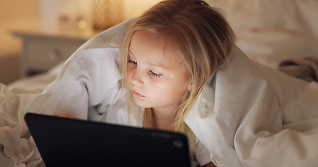 Image showing Bed, games and girl child with tablet for evening leisure entertainment online with cozy duvet. Night, relax and young kid enjoying app gaming with cyber security tech in a comfortable bedroom.