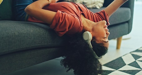 Image showing Headphones, listening and dance of black woman on a sofa excited for subscription service, technology and home connection. Happy, relax and girl portrait dancing on couch while listening to music app