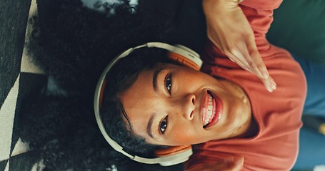 Image showing Headphones, listening and dance of black woman on a sofa excited for subscription service, technology and home connection. Happy, relax and girl portrait dancing on couch while listening to music app