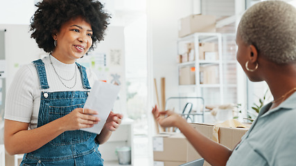 Image showing Women, envelope and smile with handshake in deal at studio or business in home. Black woman, entrepreneur or designer get letter, document or paperwork, at office in house and say thank you to client