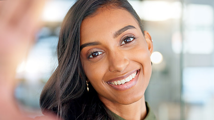 Image showing Smiling, beautiful and fresh female face winking feeling fun, silly and playful. Portrait of a happy woman head with perfect skin and healthy teeth. Closeup of a carefree natural beauty with a smile