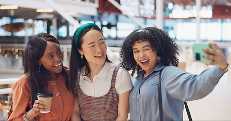 Image showing Selfie, friends and social media with woman together posing for a photograph in a mall or shopping center. Phone, social media and smile with a happy female friend group taking a picture for fun