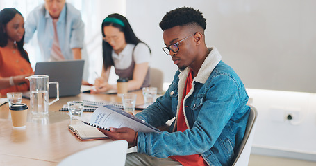 Image showing Face, business and black man in office, creative and thinking for marketing schedule, reading documents and advertising campaign. Nigerian male, employee and paperwork for collaboration and corporate