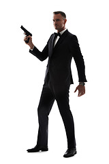 Image showing Man in suit with gun isolated on a white background for secret service agent, security or criminal businessman. Private detective, professional law person or spy with shooting weapon in studio mockup