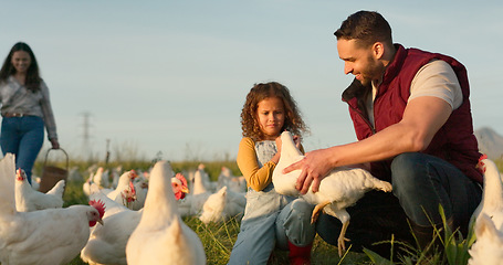 Image showing Mother, father and child with a chicken on a farm playing having fun farming and harvesting organic poultry livestock. Happy family, mom and dad enjoy quality time, memories and bonding with a girl