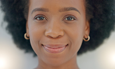 Image showing Portrait Young black woman smiling. Face of funky cheerful, gorgeous and edgy African American female or student with afro standing inside against grey background