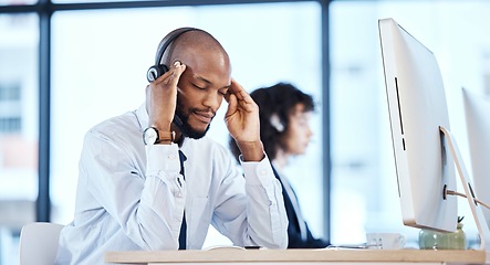 Image showing Stress, anxiety and headache by consultant worker, customer service and call center employee in office. Pain, mental health and depressed telemarking agent overworked and frustrated at the workplace