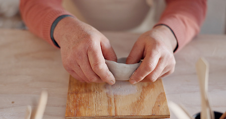 Image showing Pottery, clay bowl and craftsman hands in artist studio, workshop and small business of creative product manufacturing. Ceramic designer, artisan and sculpture skill, mold shape and handmade process