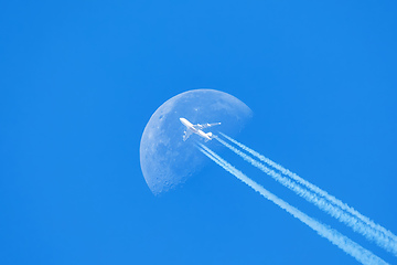 Image showing Passenger plane passes near the sun