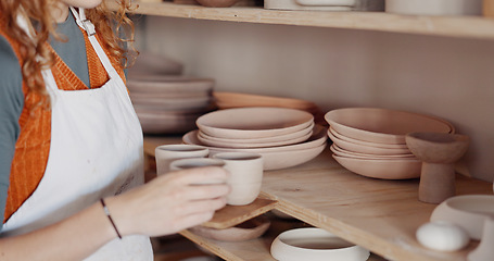 Image showing Pottery, woman artist and shelf for ceramic cups for shop, check quality for creative class or appreciate clay mold in workshop. Hobby, female entrepreneur or prepare art items to sell or for startup