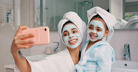 Image showing Selfie, facial and family with a mother and daughter in the bathroom of their home together. Children, love and photograph with a woman and girl kid posing for a picture while bonding in the house