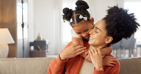 Image showing Happy, mother and child with hug, kiss and love for playful relationship bonding on living room sofa at home. Mama and kid playing together in happiness for loving care or joy relaxing on the couch