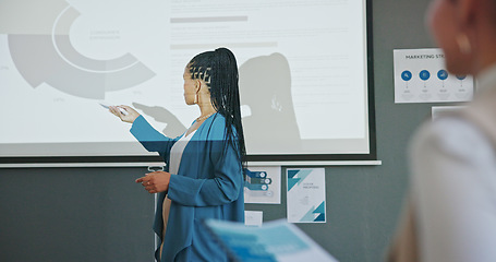 Image showing Meeting, presentation and business black woman with data analytics, profit review or growth strategy workshop. Marketing stats, sales charts and speaker in seminar on projector, training an audience